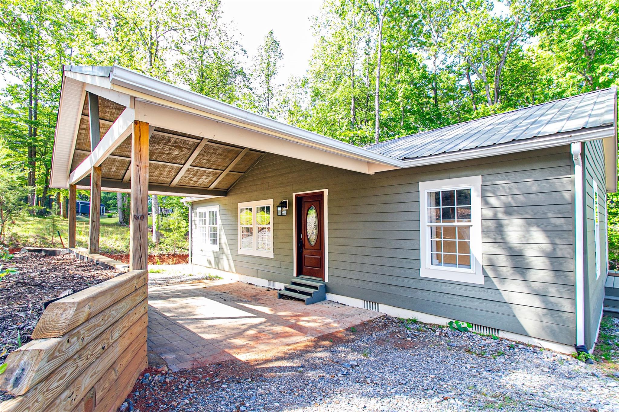 115 Cold Springs Drive Mill Spring, NC 28756 - Photo 6 of 42 a backyard of a house with barbeque oven