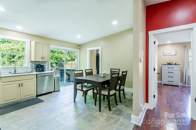 a view of a dining room with furniture and window