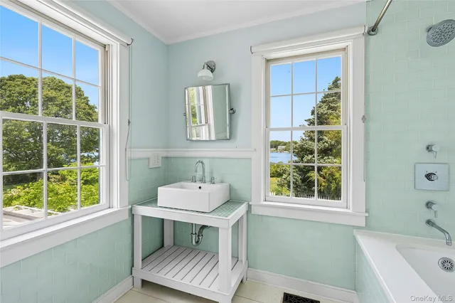 a bedroom with a bed and a window with outer view