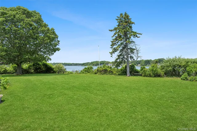 an aerial view of a house with a lake view