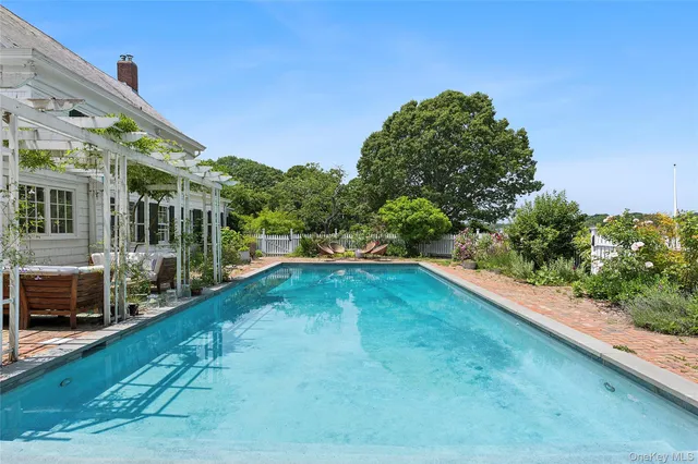 a view of a lake with sitting area