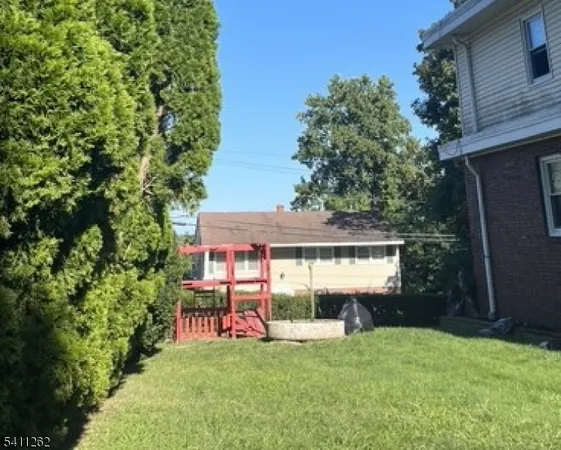 a bathroom with a double vanity sink a mirror and a shower