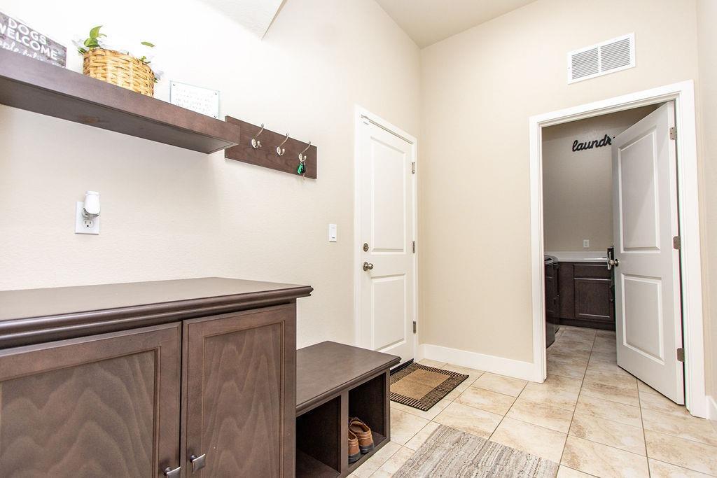2354 Ruthie Place Manteca, CA 95337 - Photo 11 of 22 a kitchen with a refrigerator and countertop