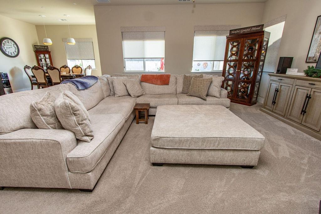 2354 Ruthie Place Manteca, CA 95337 - Photo 2 of 22 a living room with furniture and wooden floor