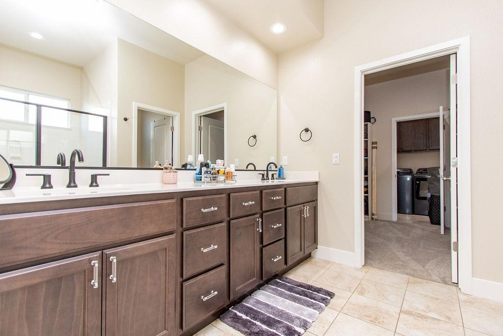 2354 Ruthie Place Manteca, CA 95337 - Photo 8 of 22 a bathroom with a sink and a mirror