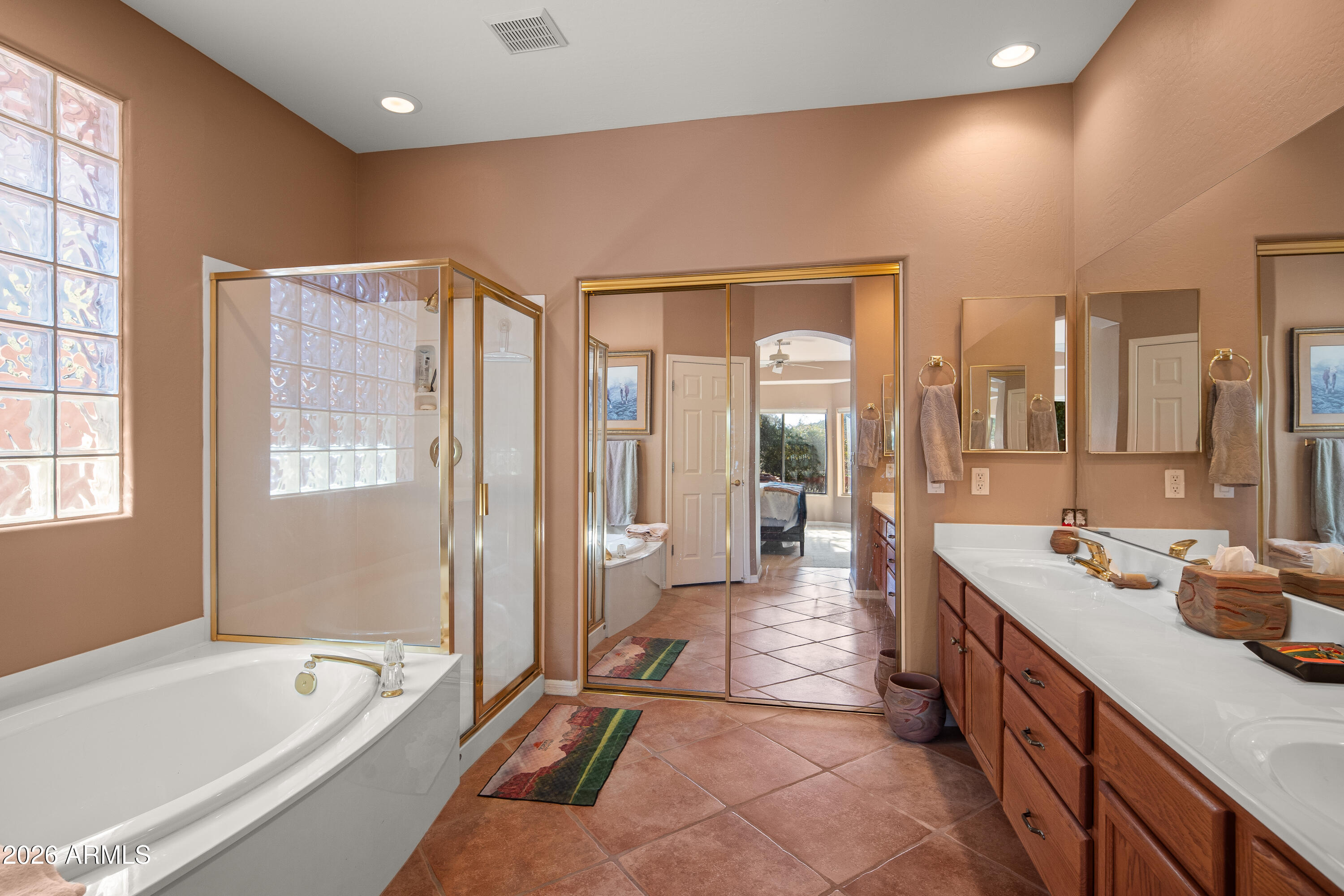 1070 Crown Ridge Road Sedona, AZ 86351 - Photo 14 of 28 a spacious bathroom with a tub sink and mirror