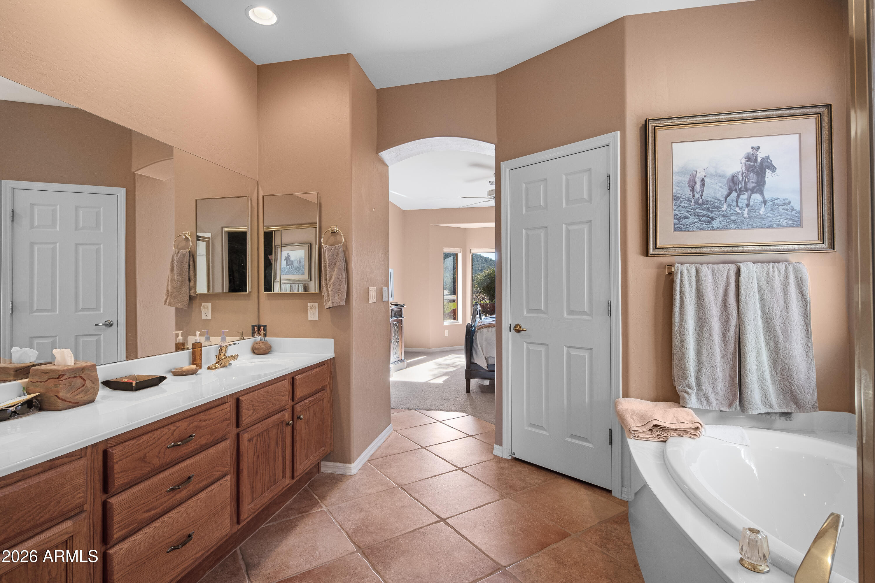 1070 Crown Ridge Road Sedona, AZ 86351 - Photo 15 of 28 a spacious bathroom with a tub sink and mirror