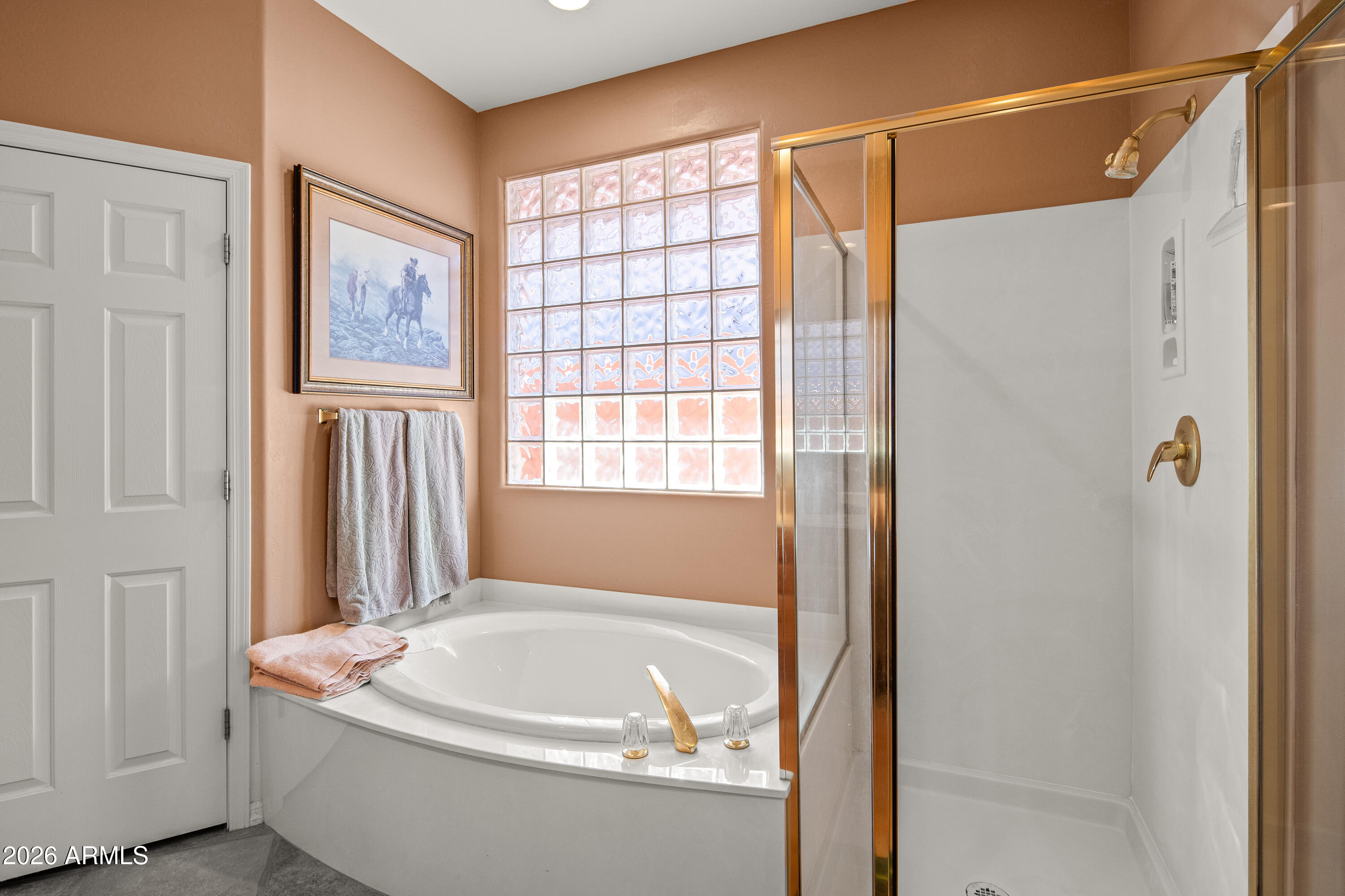 1070 Crown Ridge Road Sedona, AZ 86351 - Photo 16 of 28 a bathroom with a bathtub and a shower