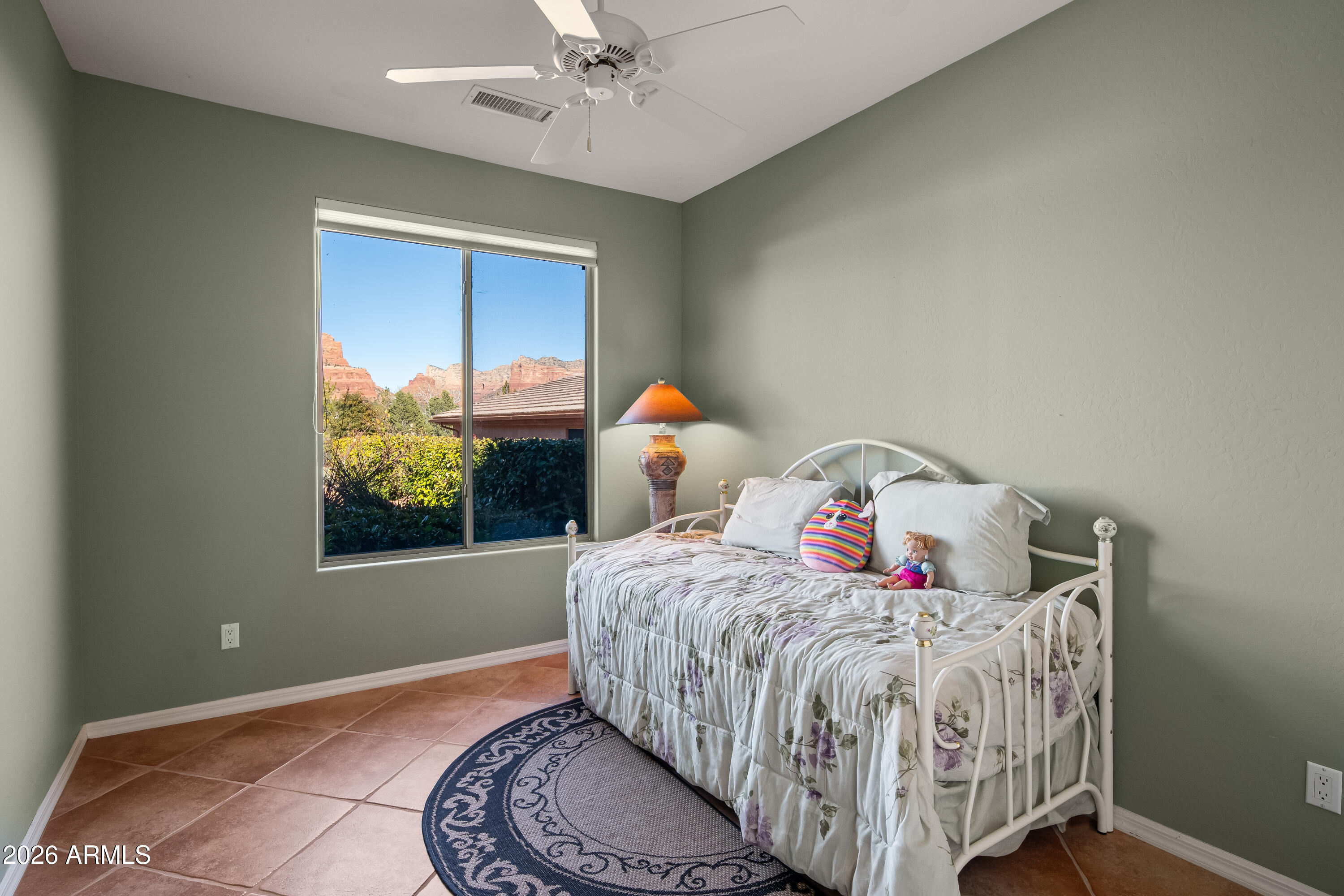 1070 Crown Ridge Road Sedona, AZ 86351 - Photo 17 of 28 a bedroom with a bed and window