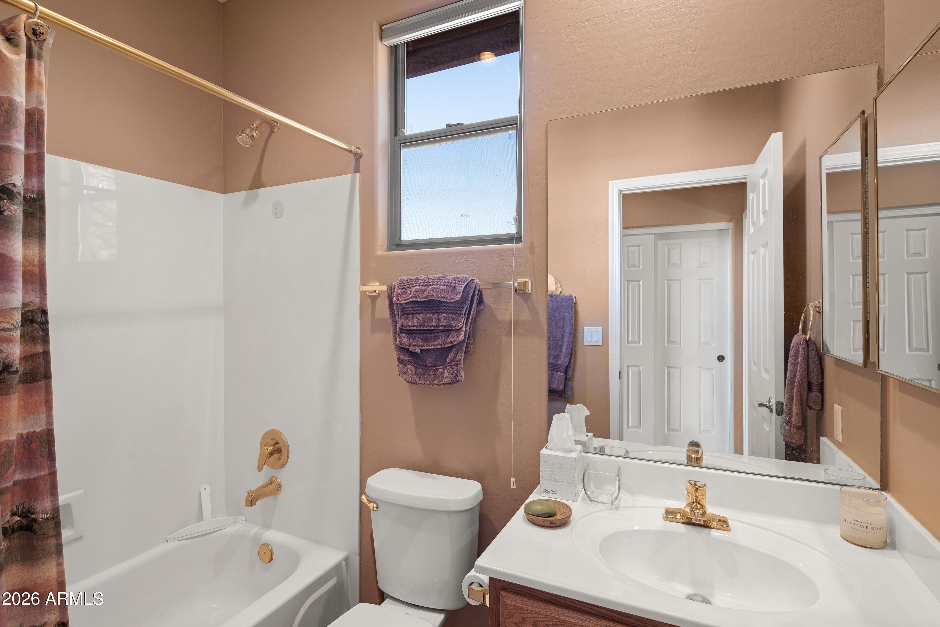 1070 Crown Ridge Road Sedona, AZ 86351 - Photo 19 of 28 a bathroom with a sink toilet and shower