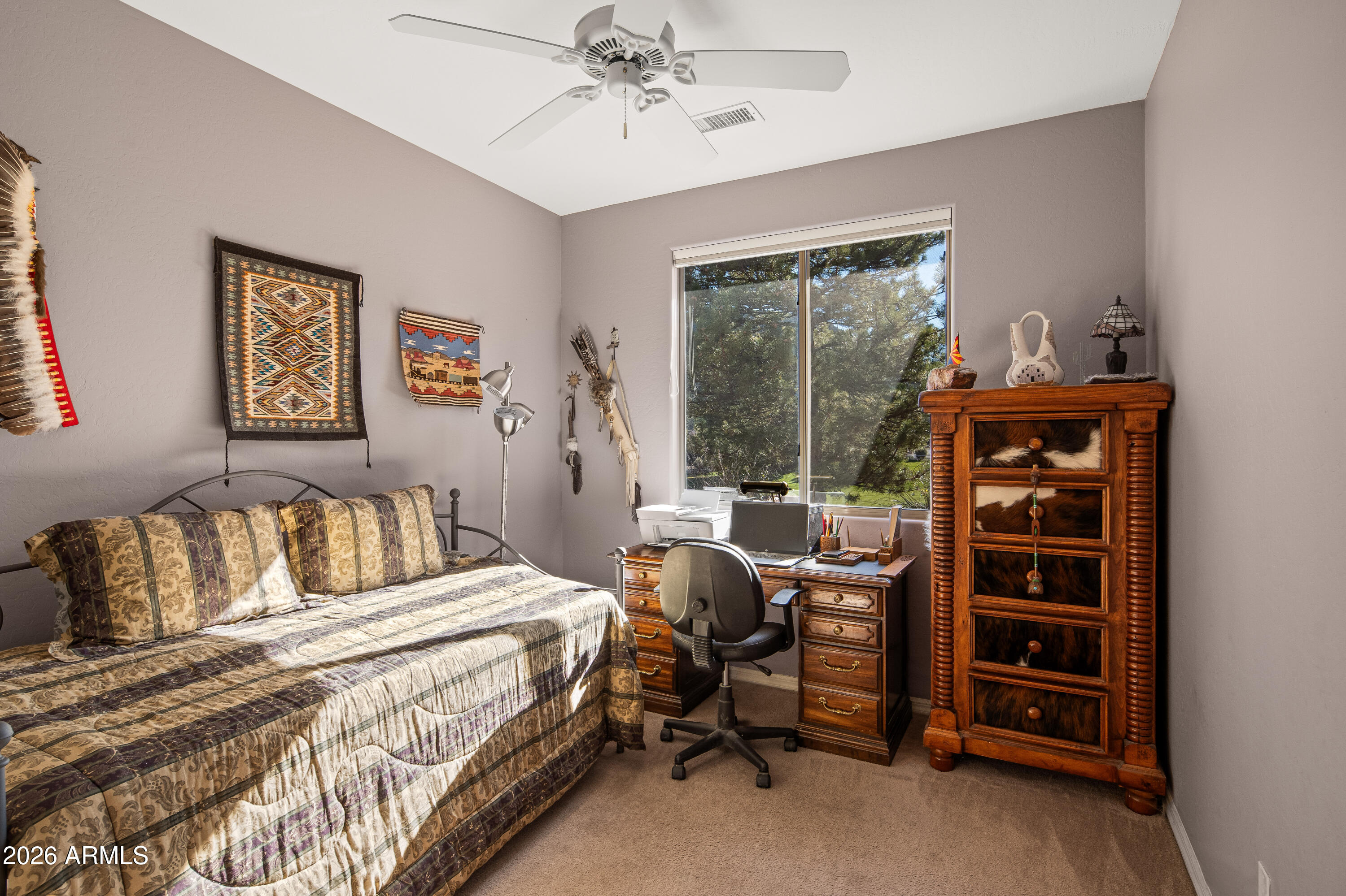 1070 Crown Ridge Road Sedona, AZ 86351 - Photo 20 of 28 a bedroom with a bed and a window