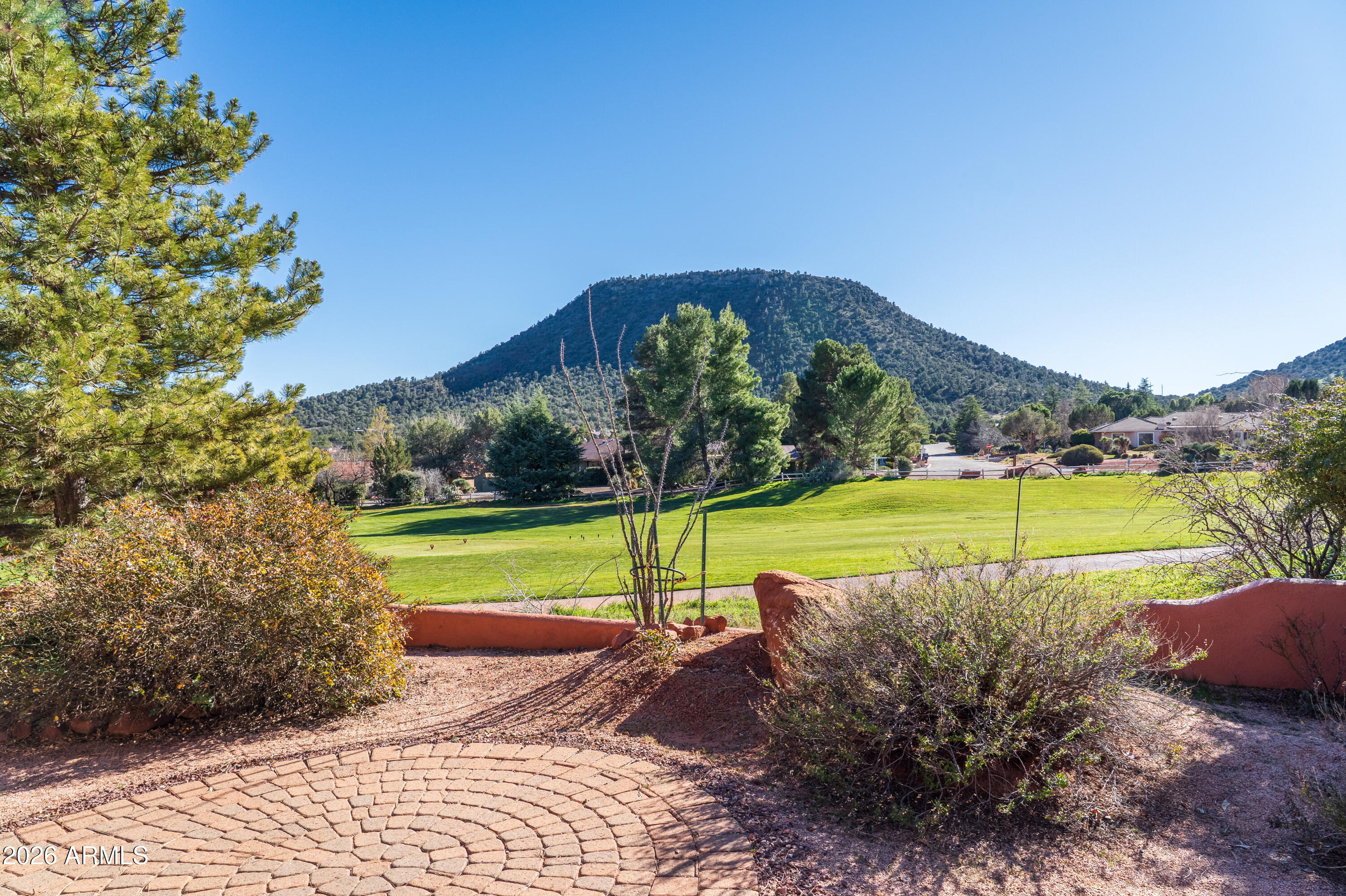 1070 Crown Ridge Road Sedona, AZ 86351 - Photo 24 of 28 a view of a swimming pool with a yard
