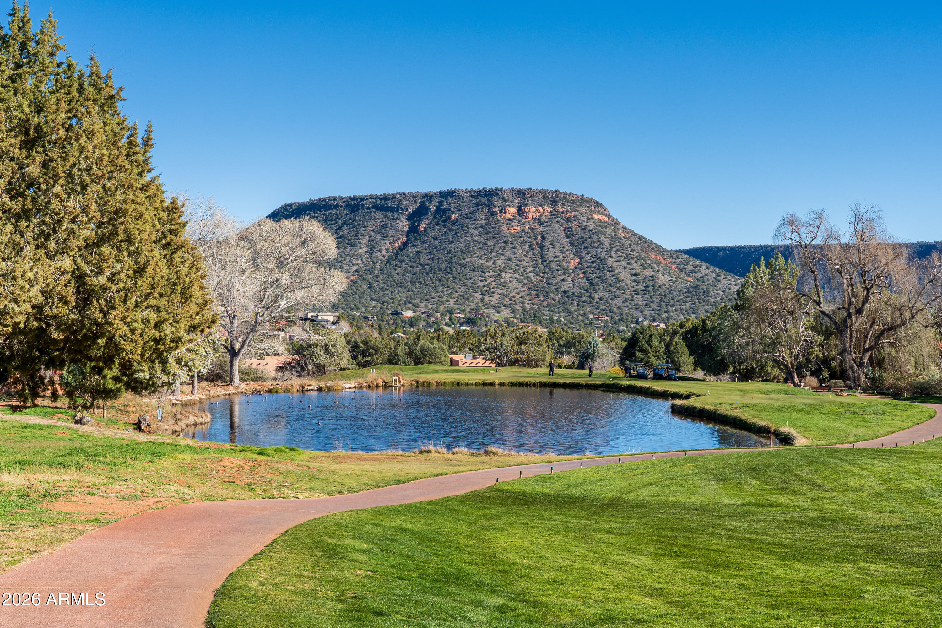 1070 Crown Ridge Road Sedona, AZ 86351 - Photo 26 of 28 a view of a swimming pool with an ocean and mountain view