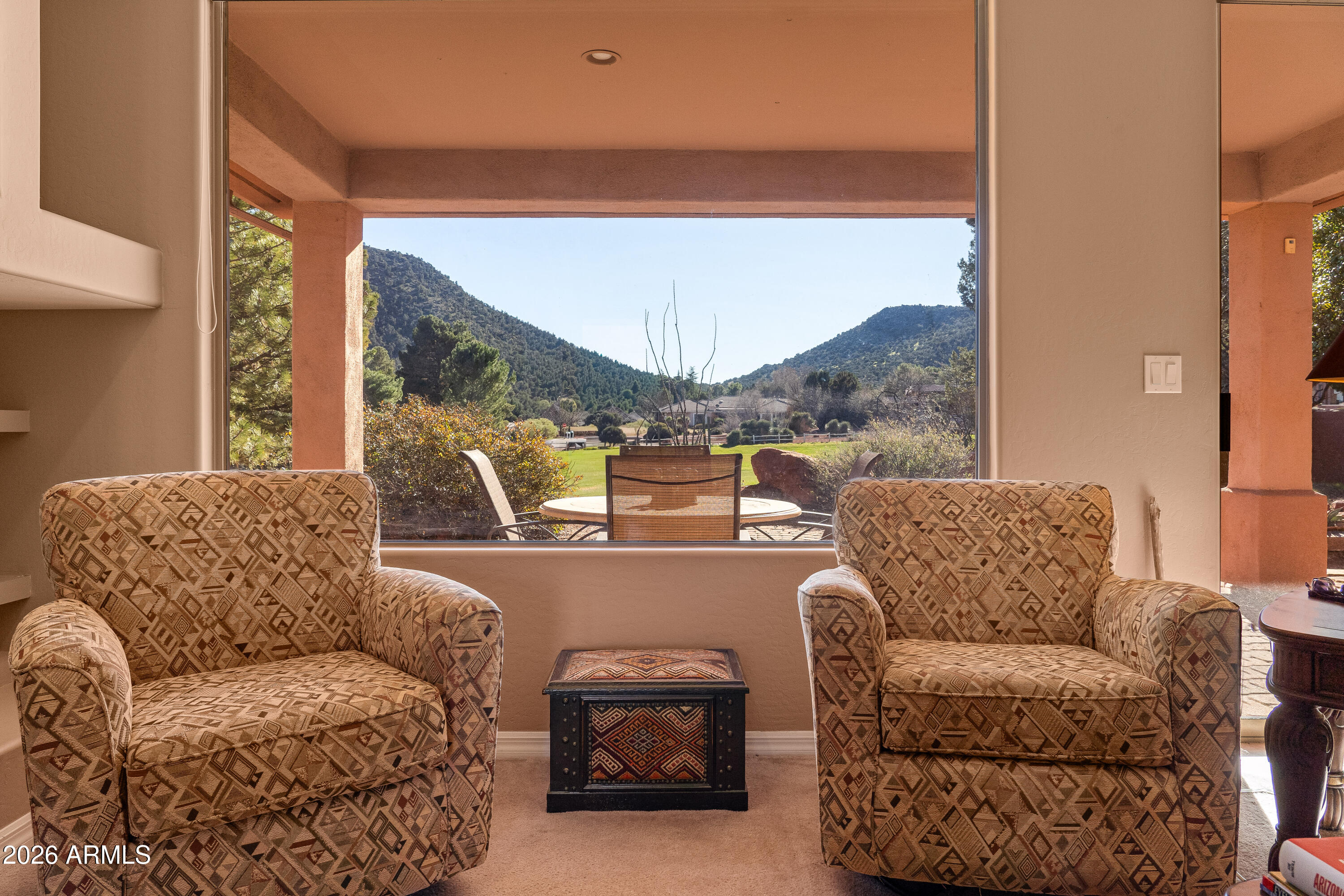 1070 Crown Ridge Road Sedona, AZ 86351 - Photo 5 of 28 a living room with furniture and a large window