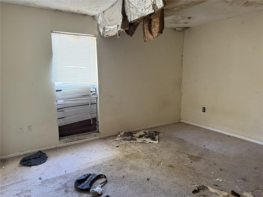 709 Southwest 75th Street, Unit 104 Gainesville, FL 32607 - Photo 15 of 34 a view of a room with rack on the wall