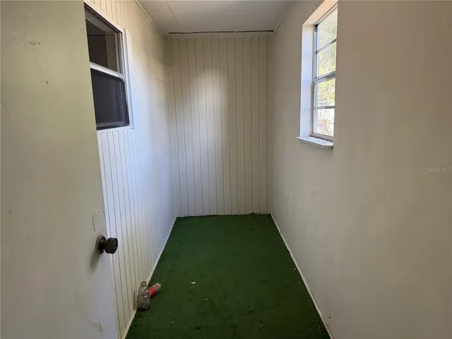 a bathroom with a glass shower door