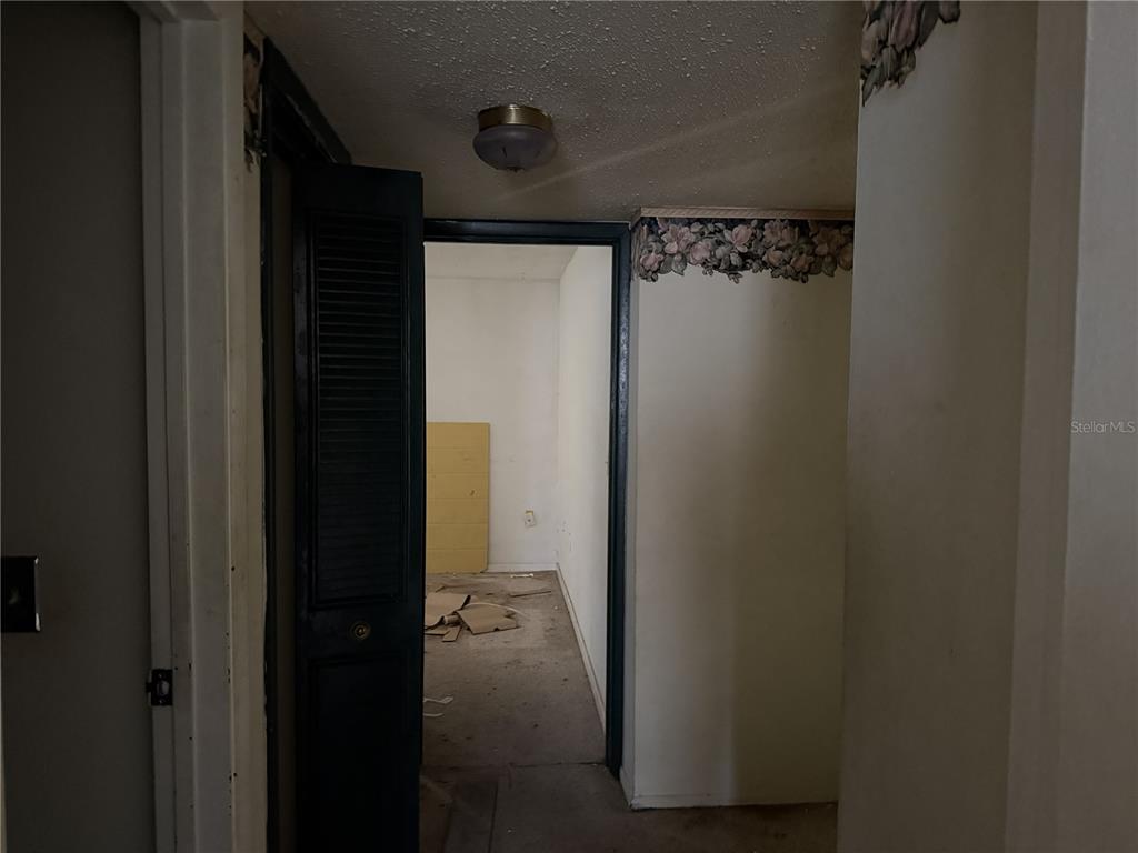 709 Southwest 75th Street, Unit 104 Gainesville, FL 32607 - Photo 20 of 34 a bathroom with a glass shower door