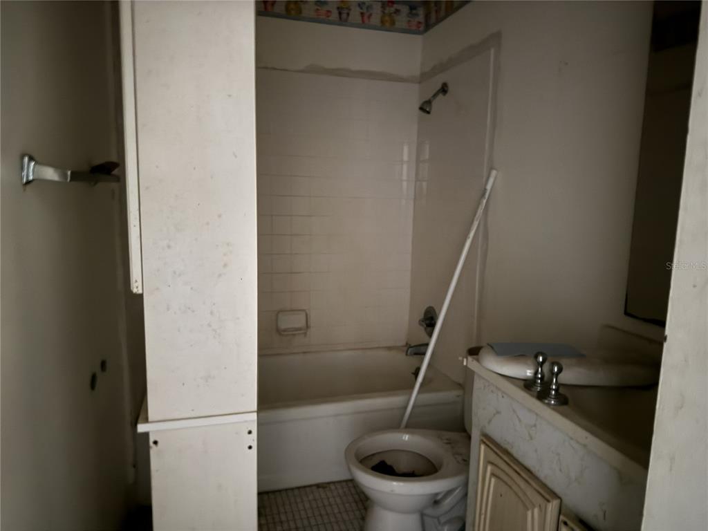 709 Southwest 75th Street, Unit 104 Gainesville, FL 32607 - Photo 21 of 34 a bathroom with a sink and toilet