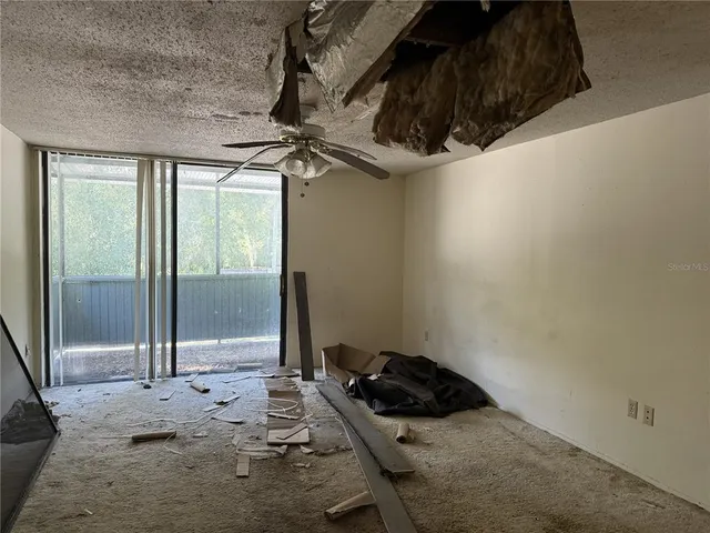a bathroom with a granite countertop sink and a window