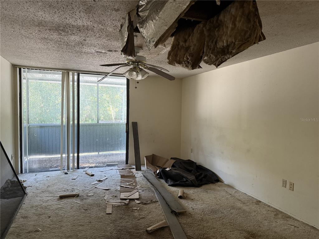 709 Southwest 75th Street, Unit 104 Gainesville, FL 32607 - Photo 28 of 34 a bedroom with a bed and a dresser