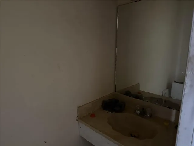 a bedroom with furniture and a gym equipment