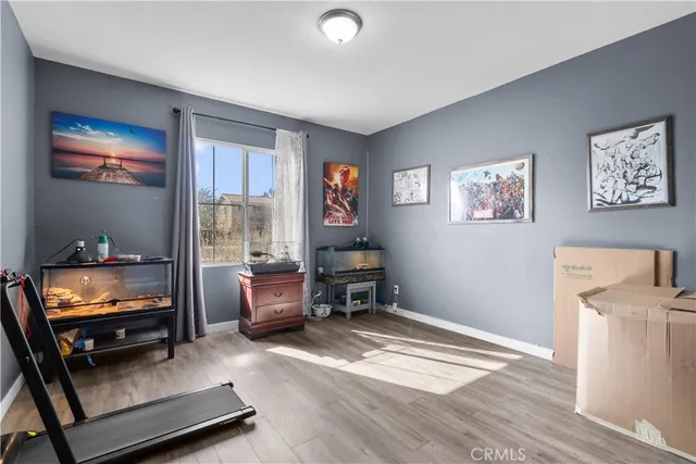 a living room with furniture and a walk in closet