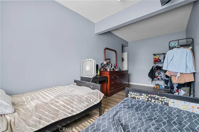 a view of a workspace with furniture and wooden floor