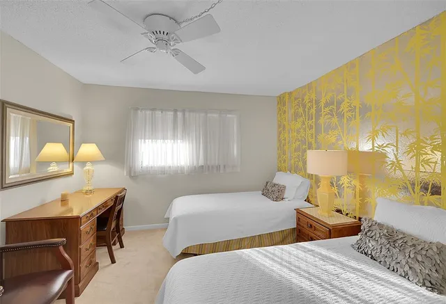 a bedroom with a bed and a lamp with window