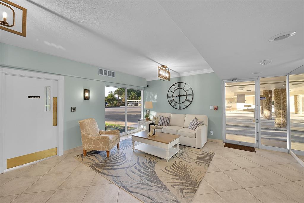 555 Northwest 4th Avenue, Unit 4190 Boca Raton, FL 33432 - Photo 14 of 18 a living room with furniture and a large window