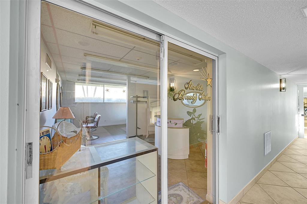 555 Northwest 4th Avenue, Unit 4190 Boca Raton, FL 33432 - Photo 15 of 18 a hallway with a view of living room