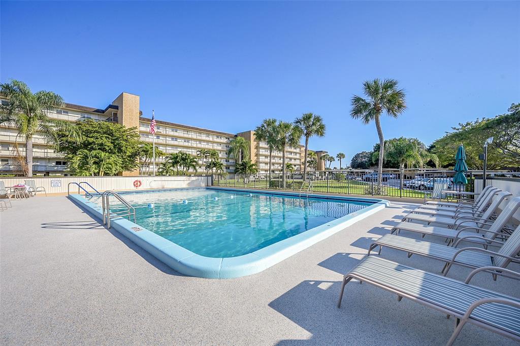 555 Northwest 4th Avenue, Unit 4190 Boca Raton, FL 33432 - Photo 16 of 18 a view of swimming pool with outdoor seating