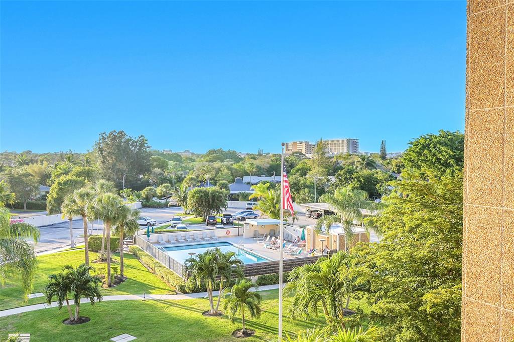 555 Northwest 4th Avenue, Unit 4190 Boca Raton, FL 33432 - Photo 17 of 18 a view of a lake with a building in the background