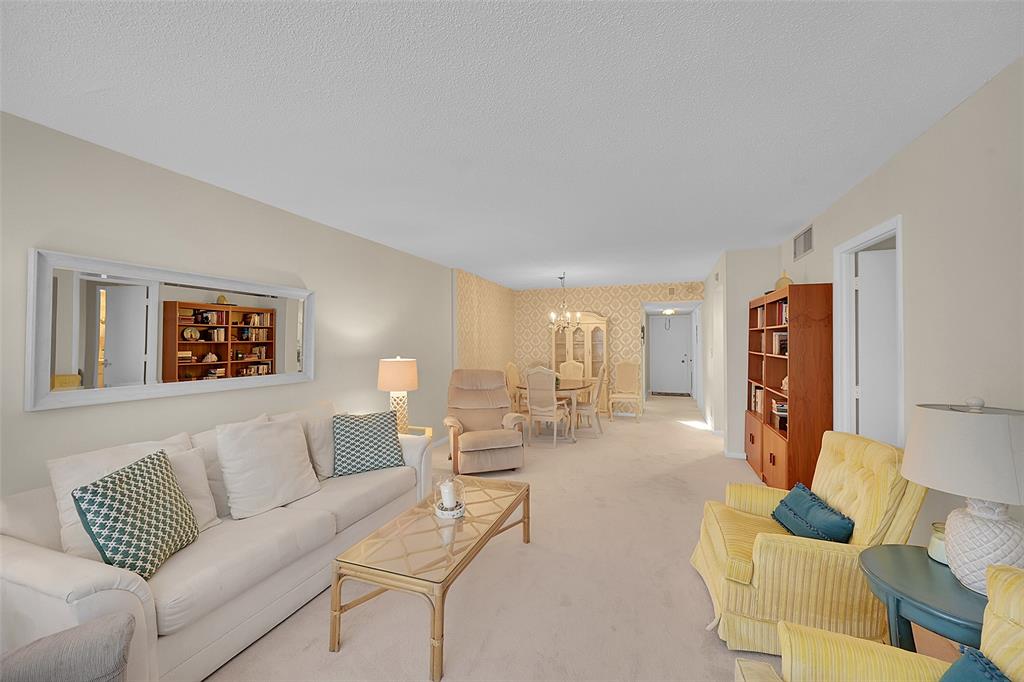 555 Northwest 4th Avenue, Unit 4190 Boca Raton, FL 33432 - Photo 4 of 18 a living room with furniture and a couch