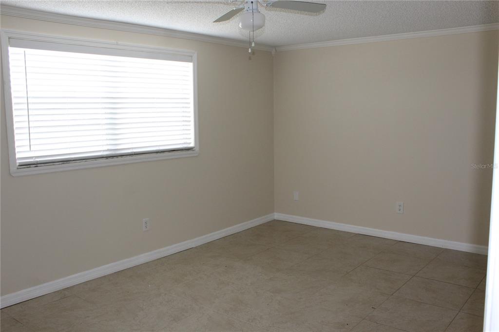 6812 Roosevelt Drive Port Richey, FL 34668 - Photo 4 of 11 an empty room with a window