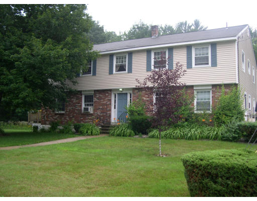 6 Colonial Road, Unit 1 6 Windham, NH 03087 - Photo 1 of 1 a view of a house with a yard