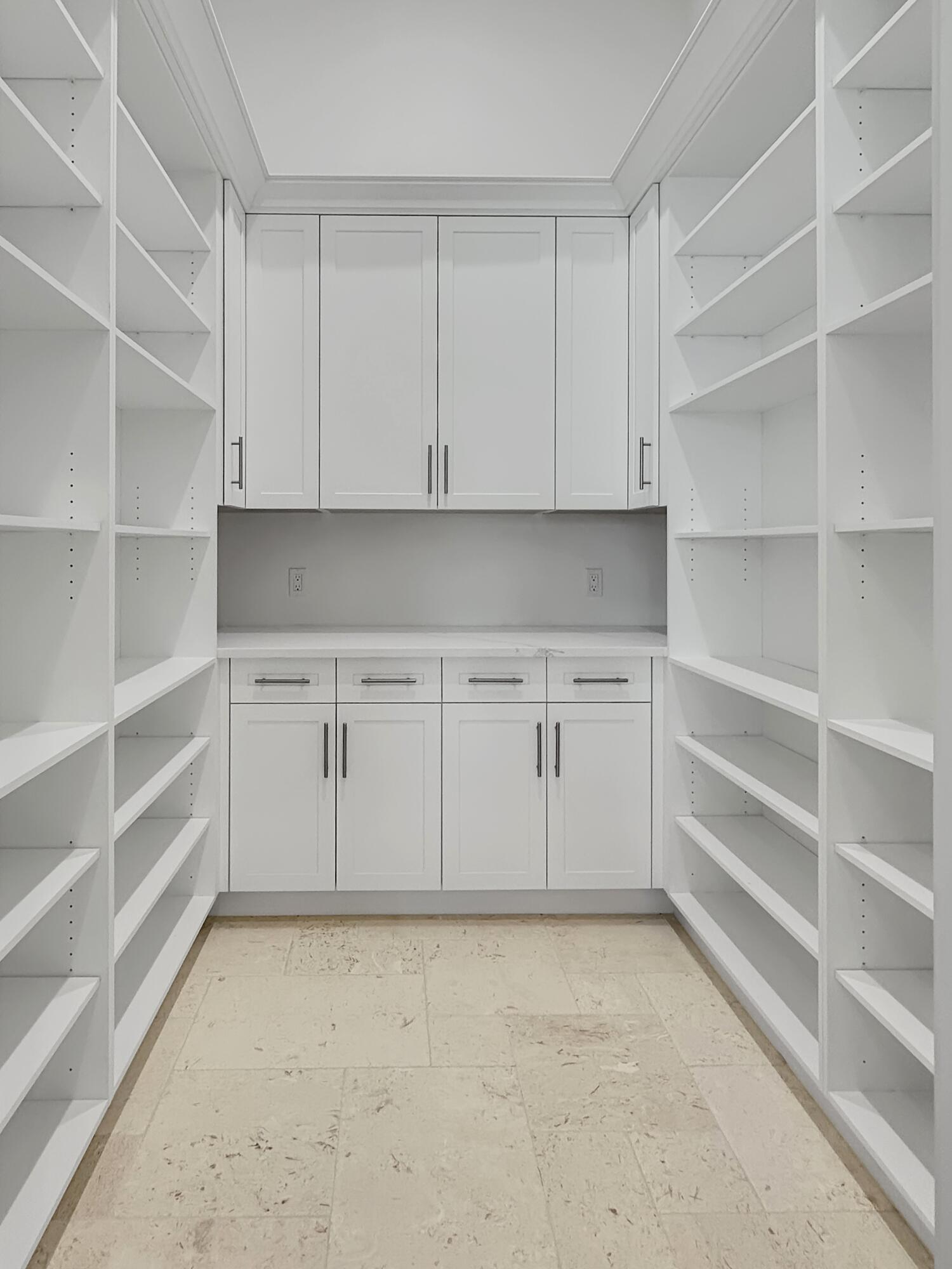 1960 San Marco Road Marco Island, FL 34145 - Photo 21 of 66 a view of cabinets and closet in kitchen
