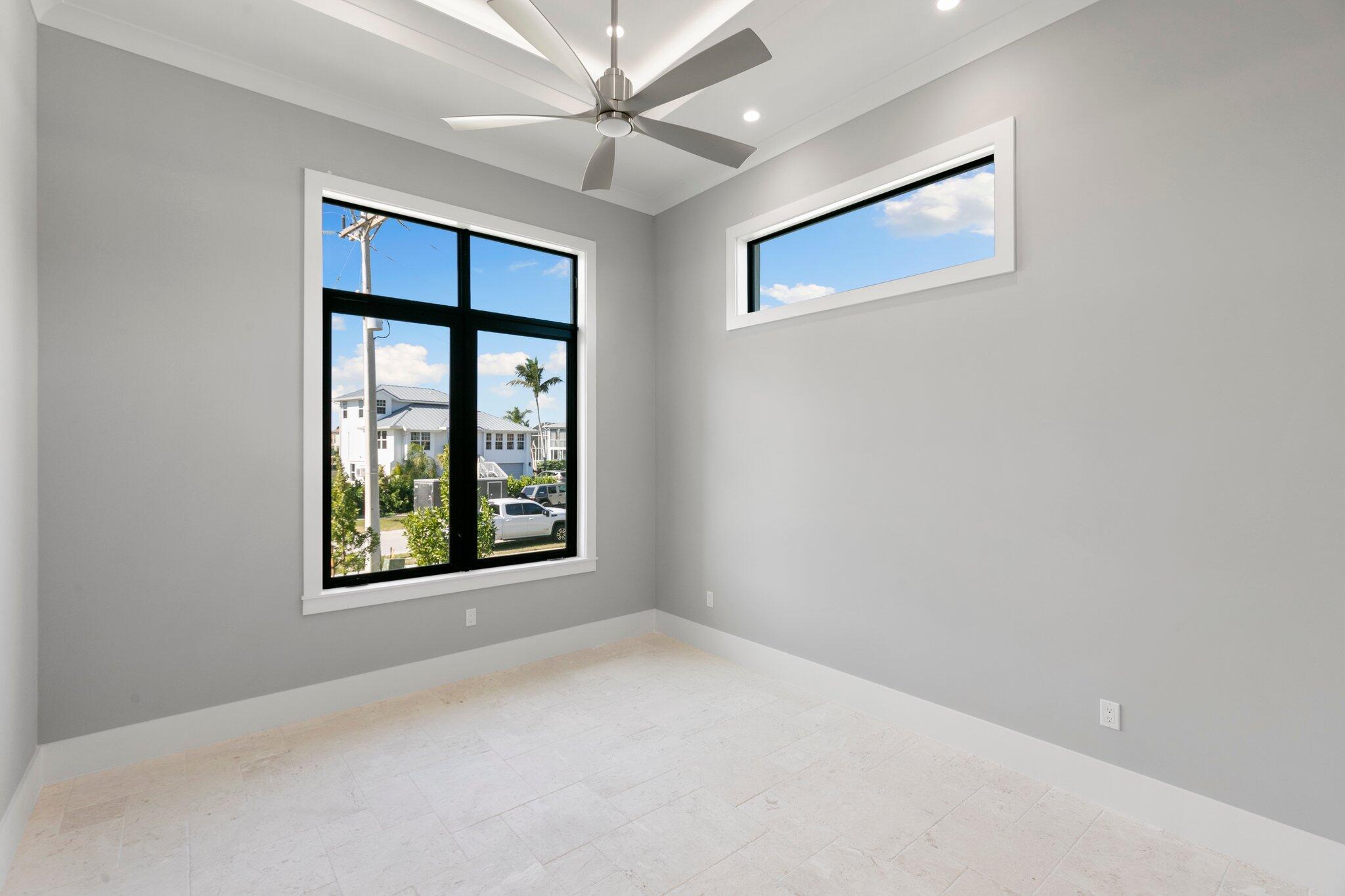 1960 San Marco Road Marco Island, FL 34145 - Photo 43 of 66 an empty room with windows and fan