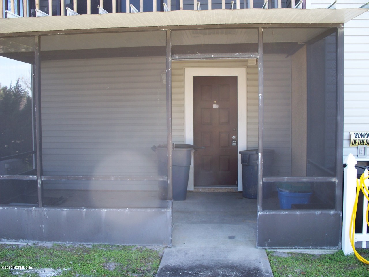 118 Rio Del Mar Street, Unit C St. Augustine, FL 32080 - Photo 6 of 16 a view of entryway with a yard