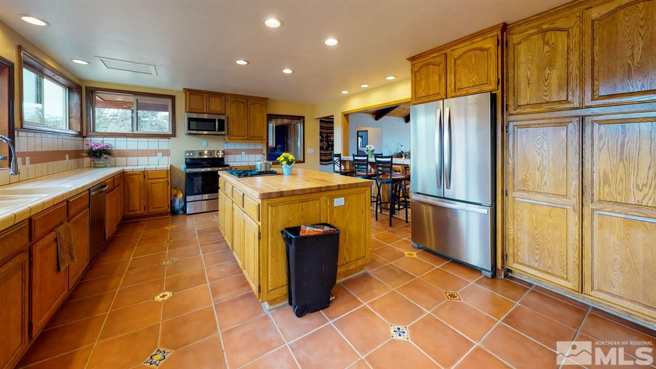 3000 Pinenut Road Gardnerville, NV 89410 - Photo 17 of 20 a kitchen with stainless steel appliances a refrigerator sink and cabinets