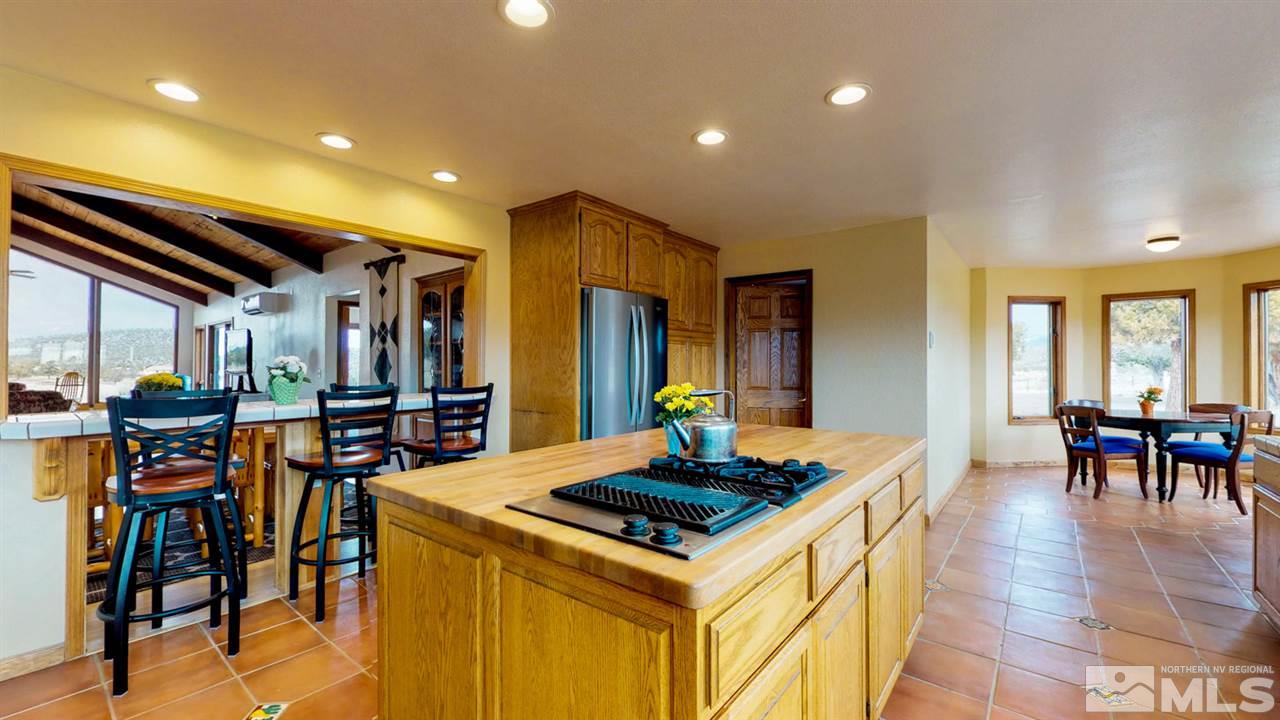 3000 Pinenut Road Gardnerville, NV 89410 - Photo 3 of 20 a kitchen that has a table and chairs in it