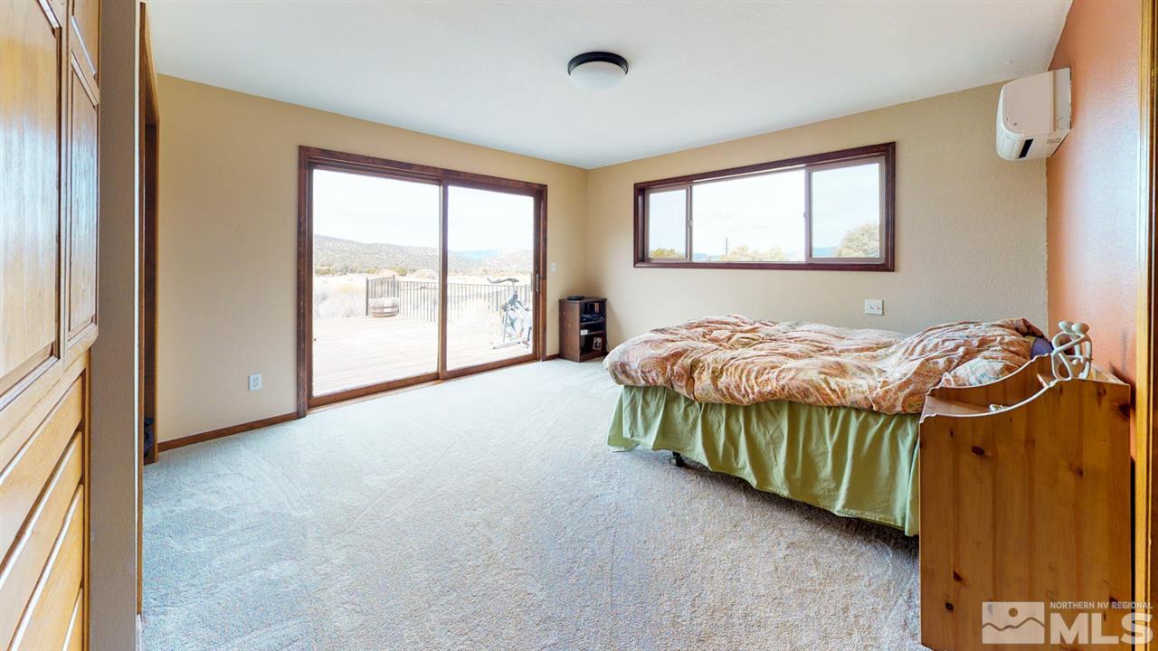 3000 Pinenut Road Gardnerville, NV 89410 - Photo 7 of 20 a bedroom with a bed and a window