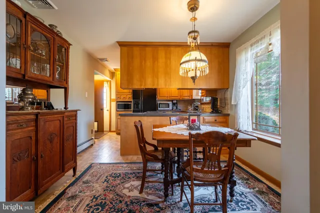 a bathroom with a sink toilet and mirror
