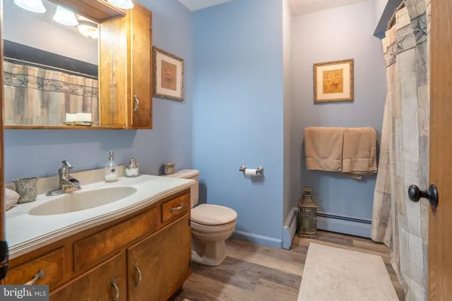 a kitchen with stainless steel appliances granite countertop a refrigerator a sink and a stove