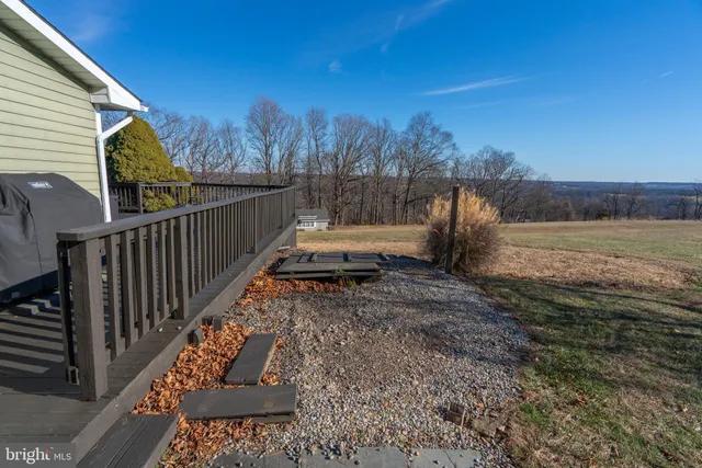a view of house with backyard and garden