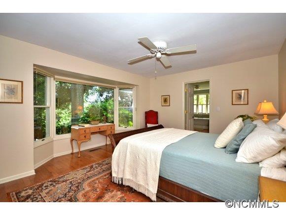 1001 Golden Road Tryon, NC 28782 - Photo 12 of 18 a bedroom with a large bed and a window
