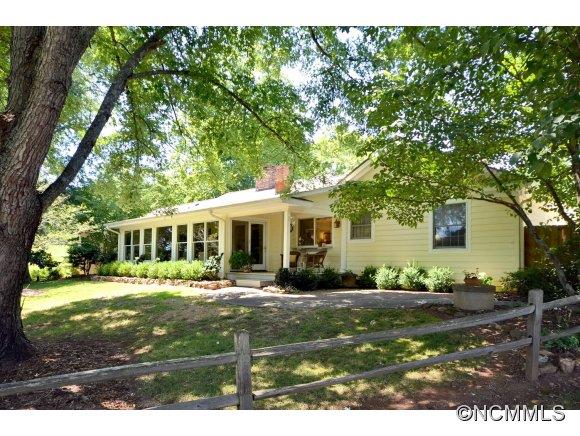 1001 Golden Road Tryon, NC 28782 - Photo 16 of 18 a front view of a house with a garden