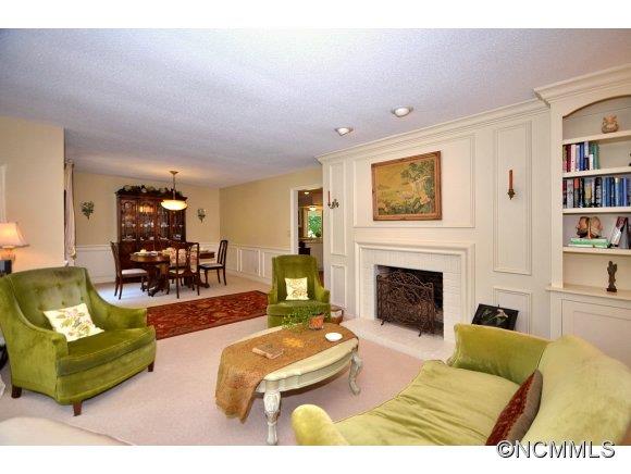 1001 Golden Road Tryon, NC 28782 - Photo 4 of 18 a living room with furniture and a fireplace