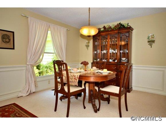 1001 Golden Road Tryon, NC 28782 - Photo 8 of 18 a view of a dining room with furniture and window