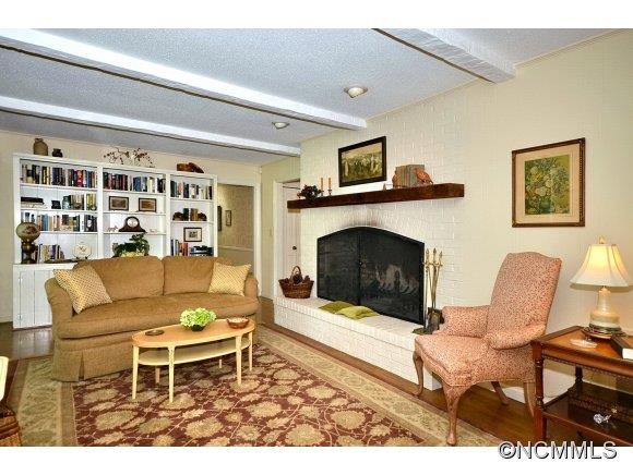1001 Golden Road Tryon, NC 28782 - Photo 10 of 18 a living room with furniture and a fireplace