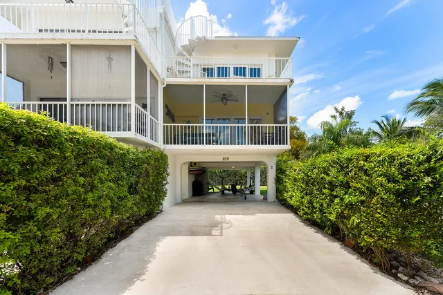 a view of house with an outdoor space and porch